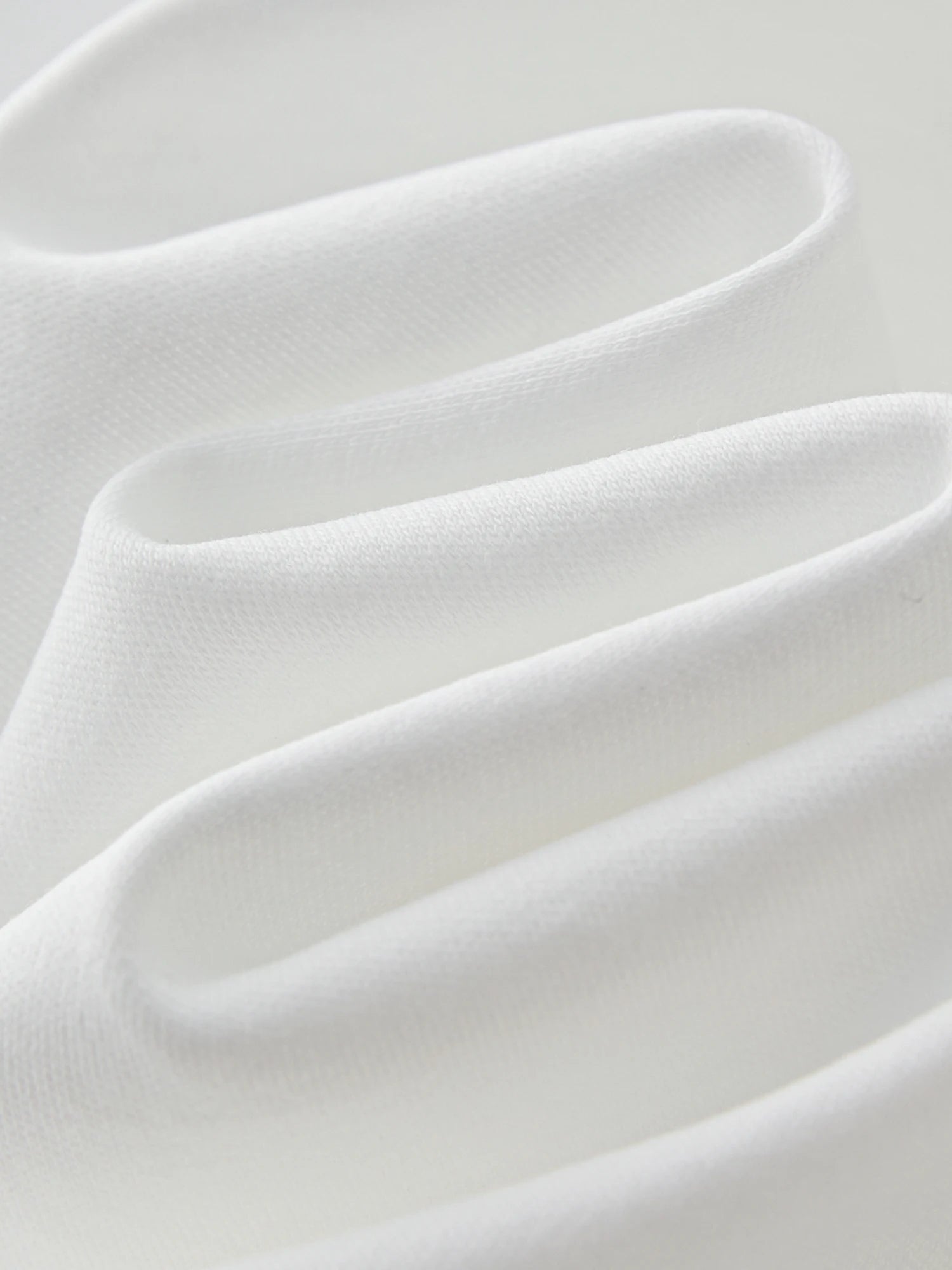 FSLE 【Premium Series】Design-inspired Asymmetric Twisted Pleated Solid Color Short-sleeved T-shirt for Women 25FE12021