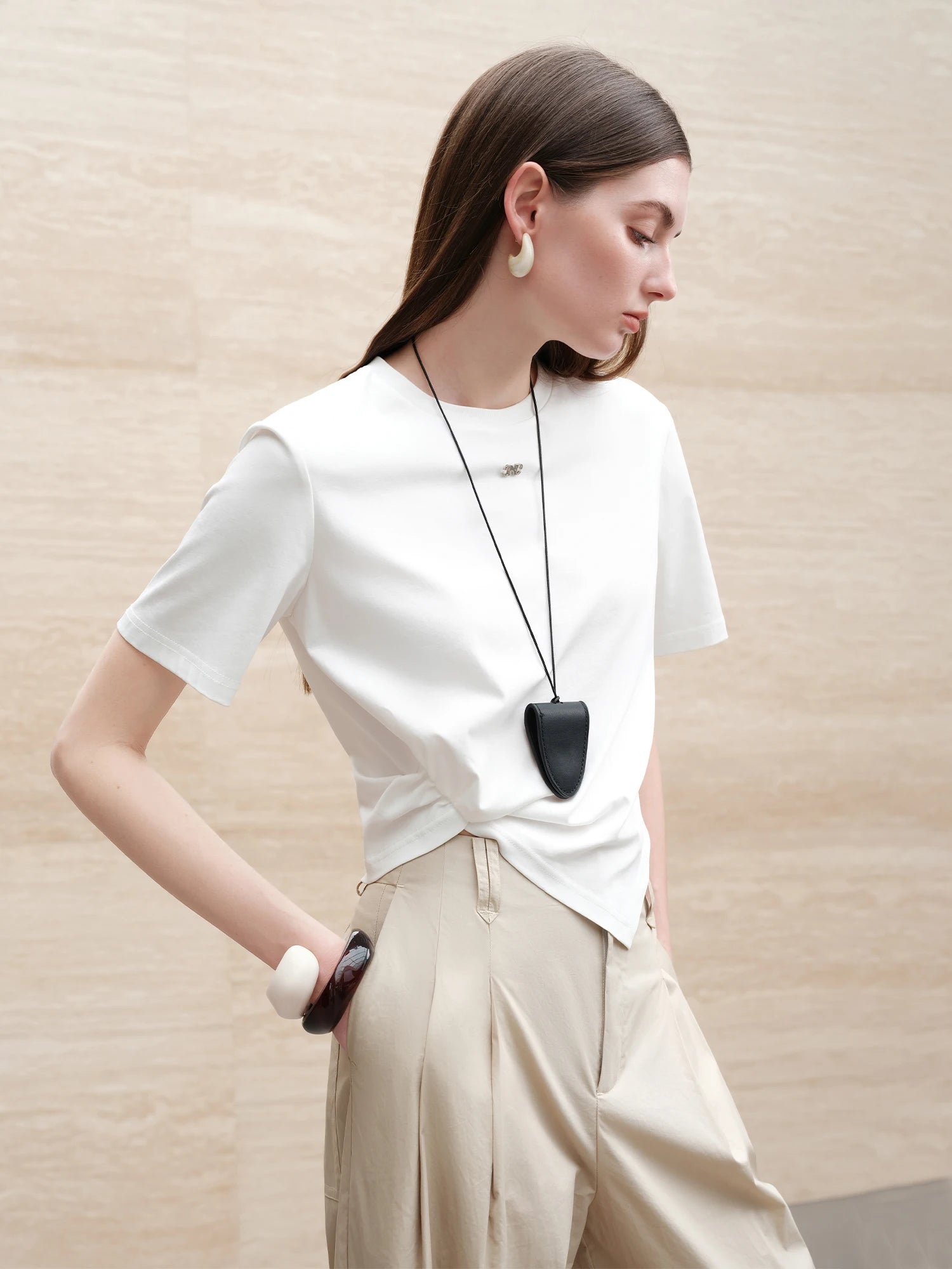 FSLE 【Premium Series】Design-inspired Asymmetric Twisted Pleated Solid Color Short-sleeved T-shirt for Women 25FE12021